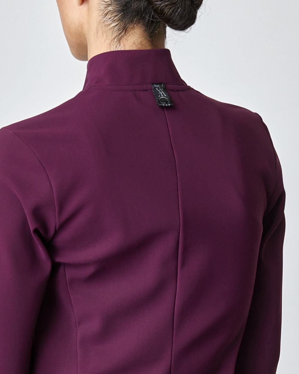 Burgundy Signature Riding Jacket made from Italian jersey fiber, featuring a fitted silhouette and concealed pockets.