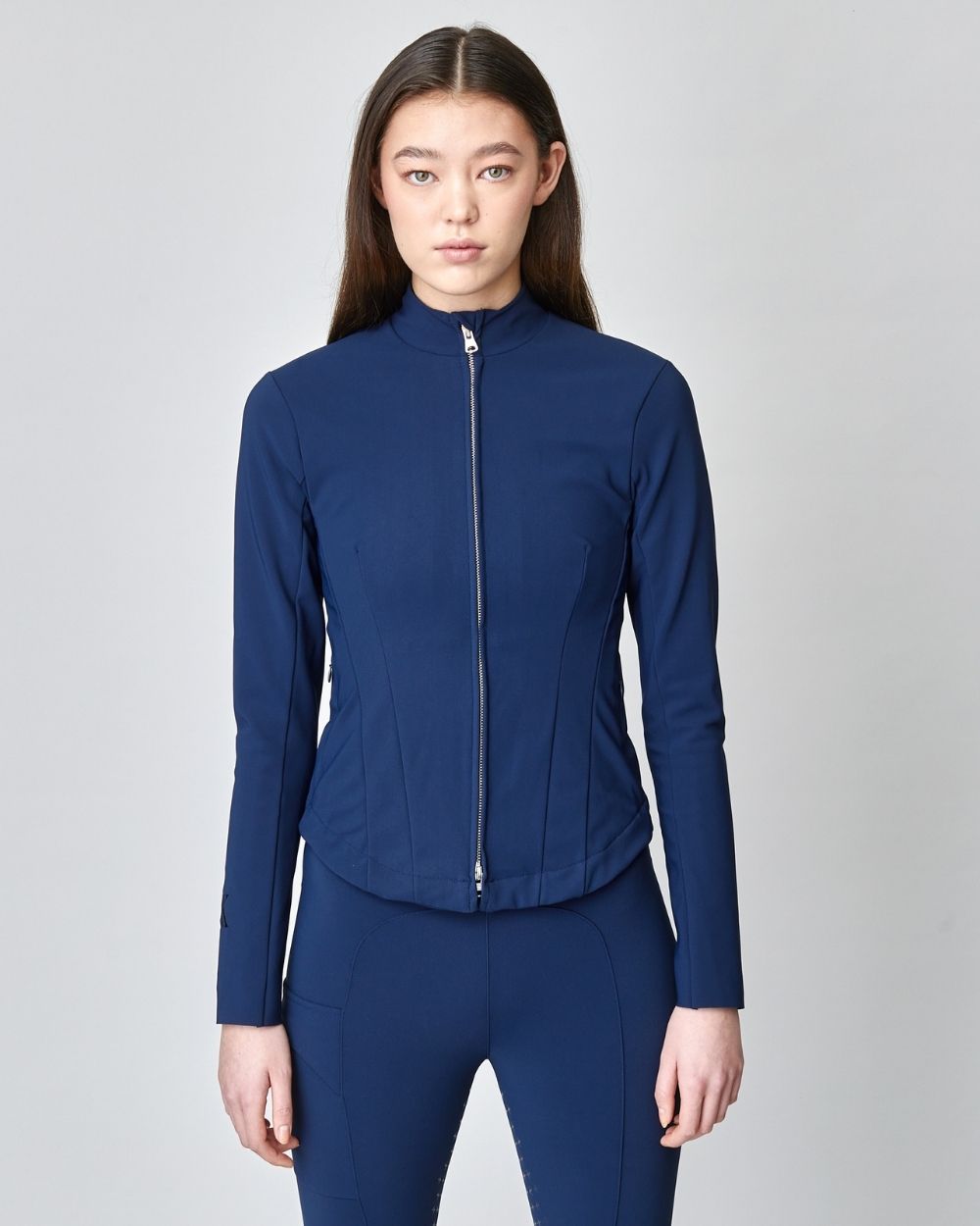 Signature Riding Jacket in Navy, crafted from Italian jersey fiber, featuring a fitted silhouette and concealed pockets.