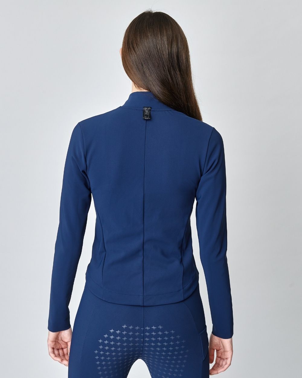 Signature Riding Jacket in Navy, crafted from Italian jersey fiber, featuring a fitted silhouette and concealed pockets.