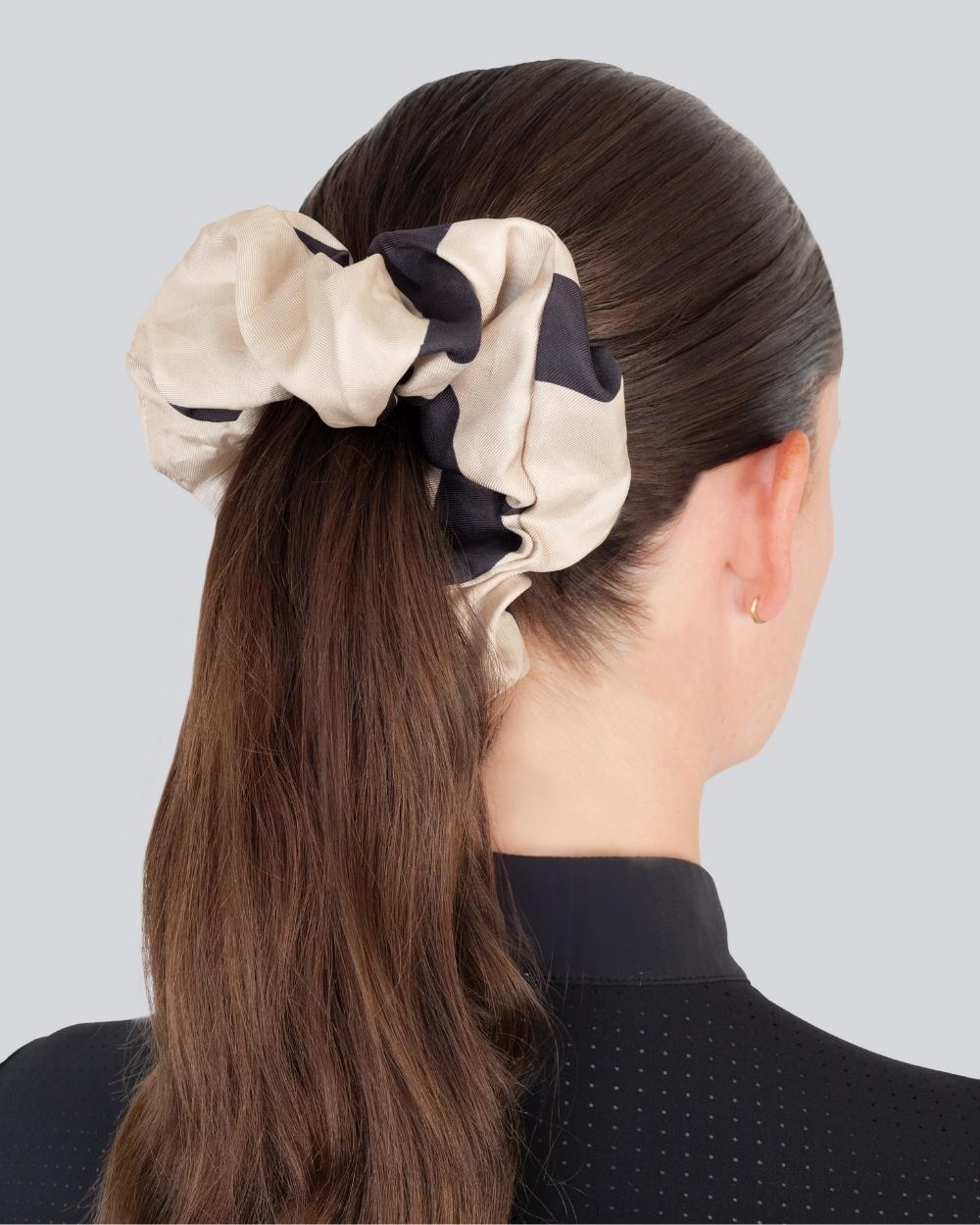 Silk Scrunchie Tan featuring Yagya’s signature print, made from 100% Italian silk, elegantly styled on a hair model.