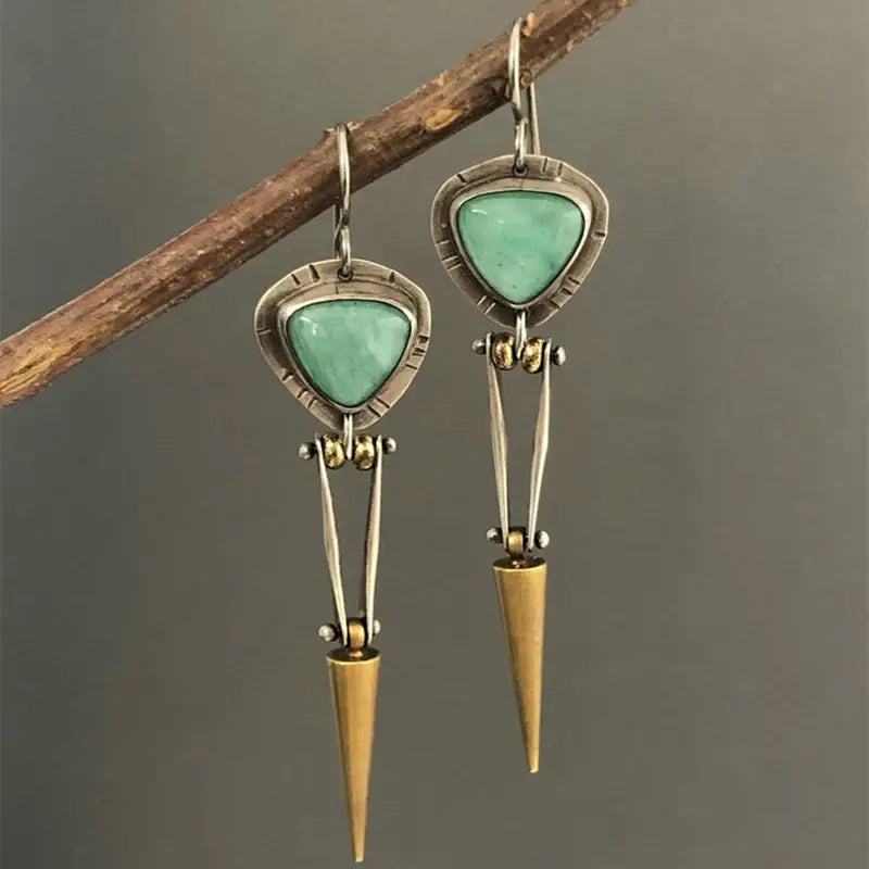 Elegant silver plated dangle earrings featuring turquoise stones, perfect for bohemian style.