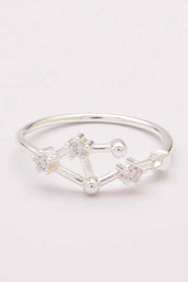 Silver ring with constellation design.