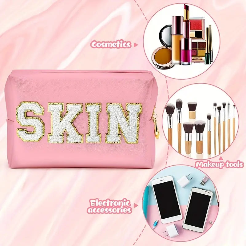 A stylish pink SKIN Cosmetic Bag, perfect for organizing makeup and beauty products while traveling.