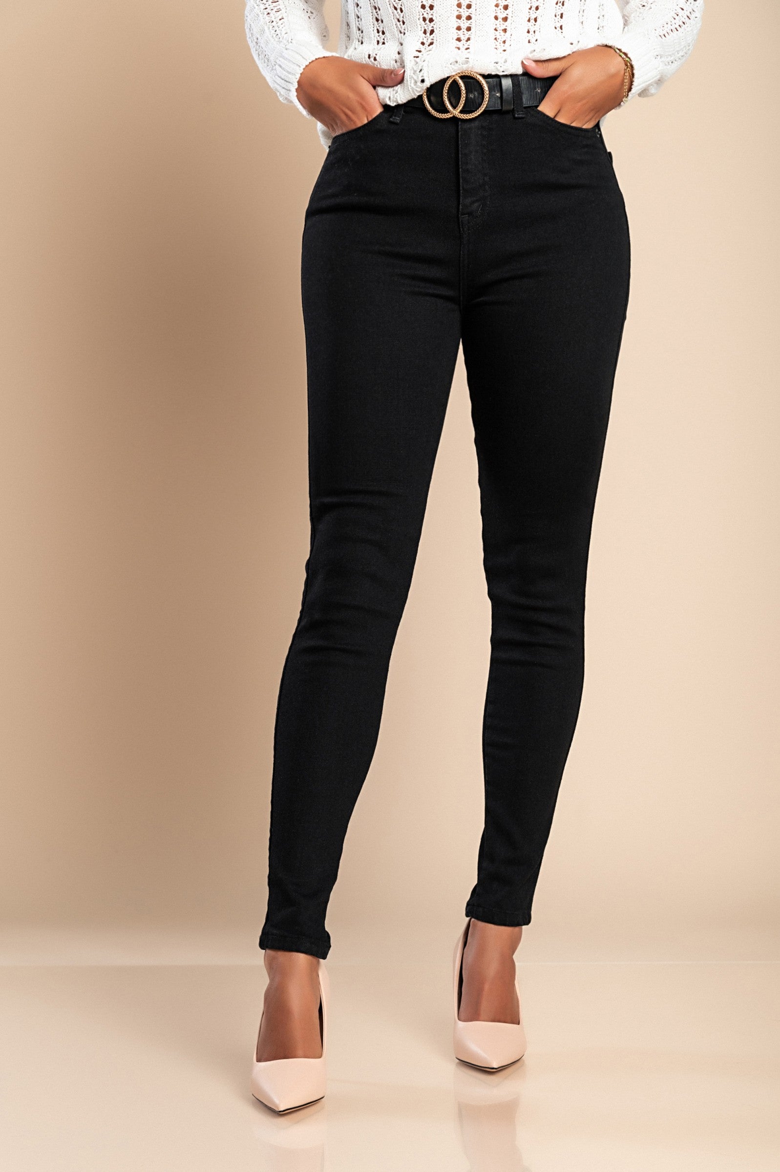 A pair of black skinny stretch jeans featuring a tapered leg, front and back pockets, zip and button closure, made from high-quality cotton.