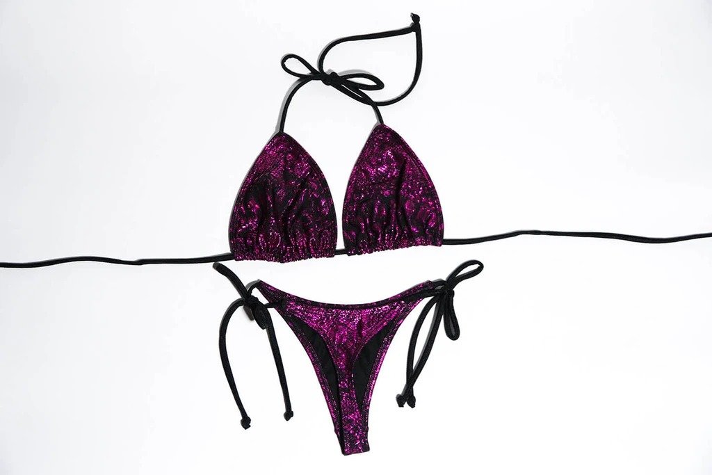 Skyla two-piece set featuring adjustable side strings, designed to accentuate curves elegantly.