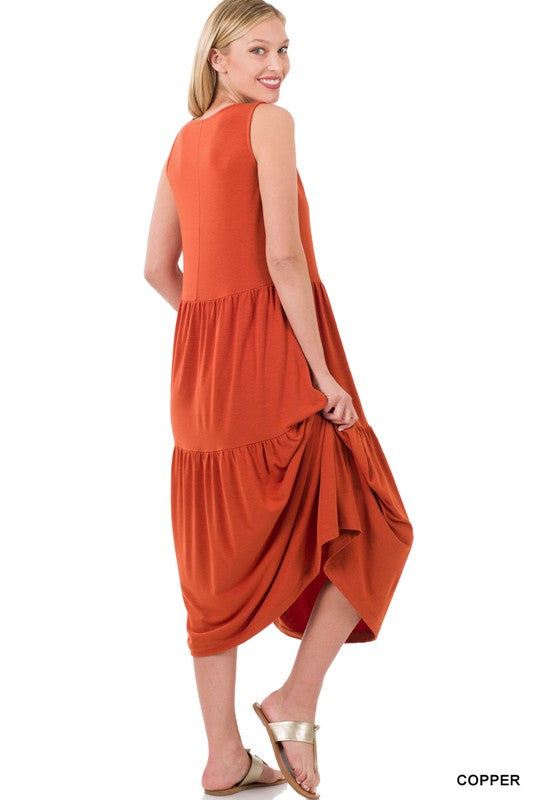 A stylish sleeveless tiered midi dress featuring a flowy ruffle skirt, available in various colors, perfect for spring and summer outings.