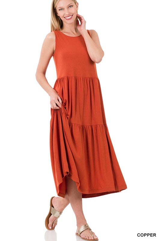 A stylish sleeveless tiered midi dress featuring a flowy ruffle skirt, available in various colors, perfect for spring and summer outings.