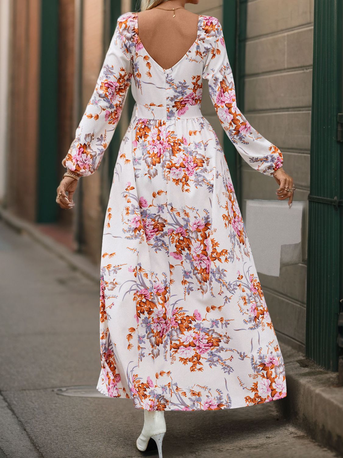 A stylish Slit Printed Surplice Long Sleeve Maxi Dress featuring a slit design, long sleeves, and a flattering silhouette, perfect for various occasions.