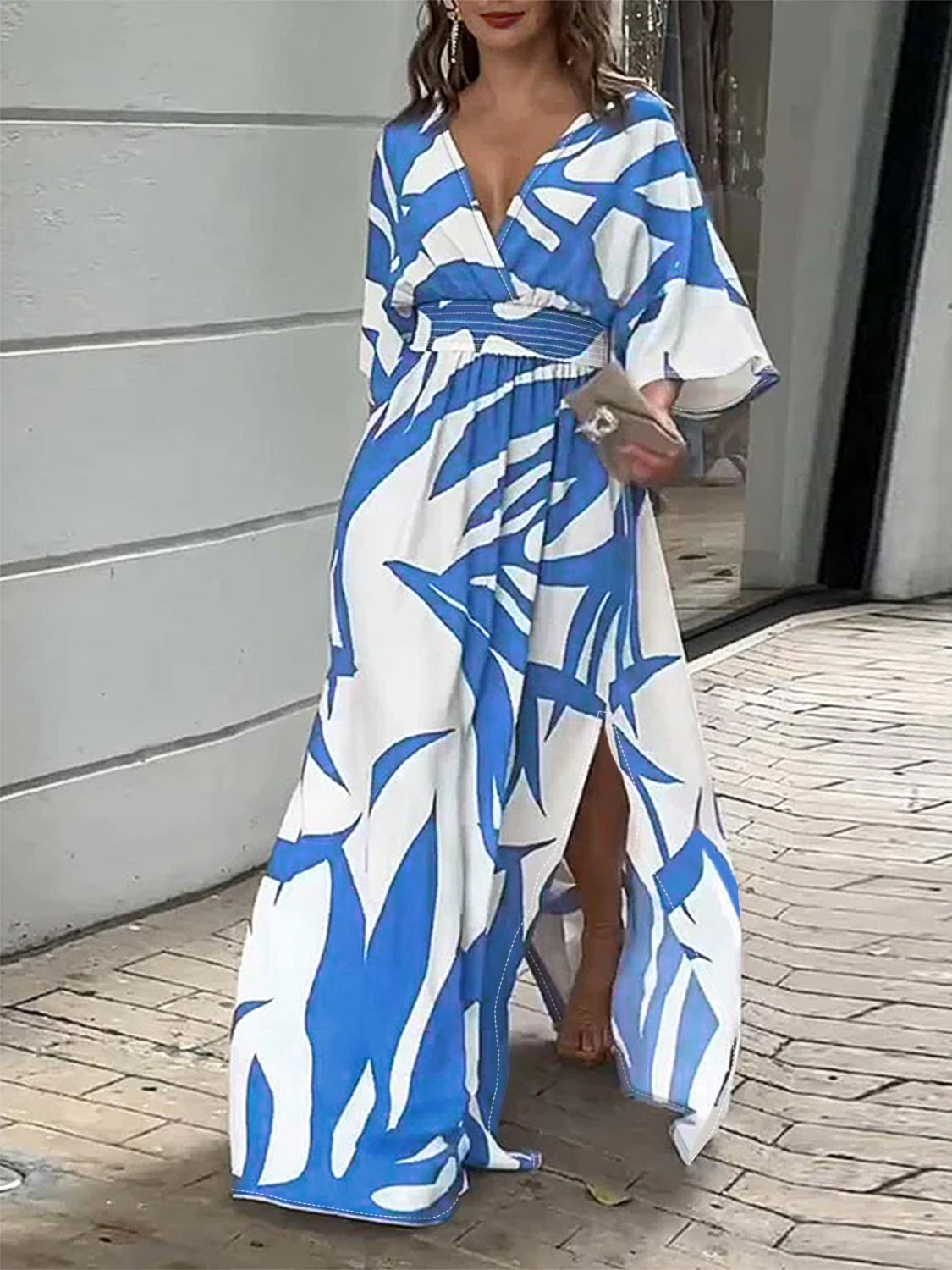 A stylish Slit Printed Surplice Maxi Dress featuring a chic slit, designed for elegance and comfort, made from a soft polyester-elastane blend.