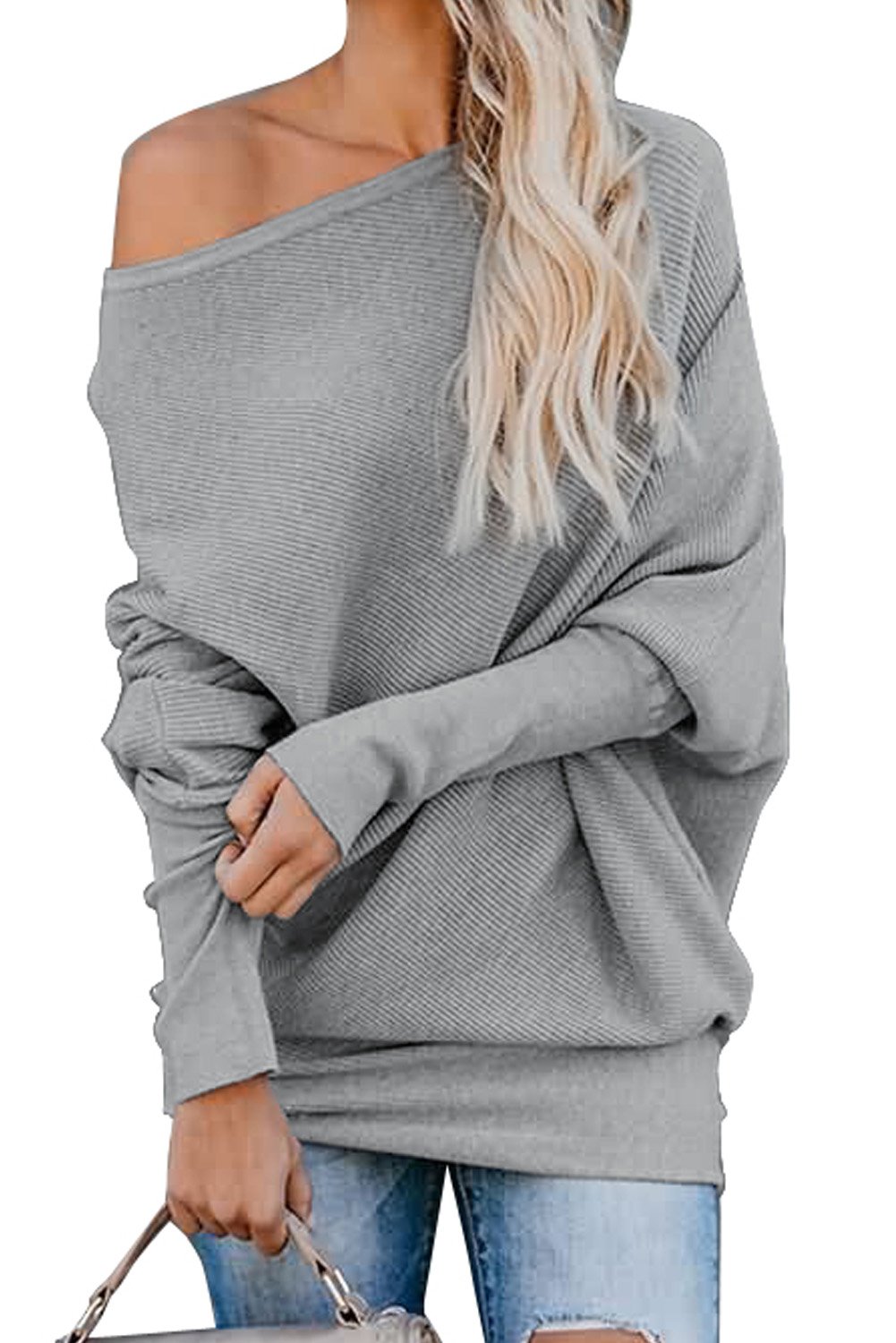 A stylish slouchy one shoulder dolman sleeves ribbed sweater in a solid color, showcasing its relaxed fit and elegant design.