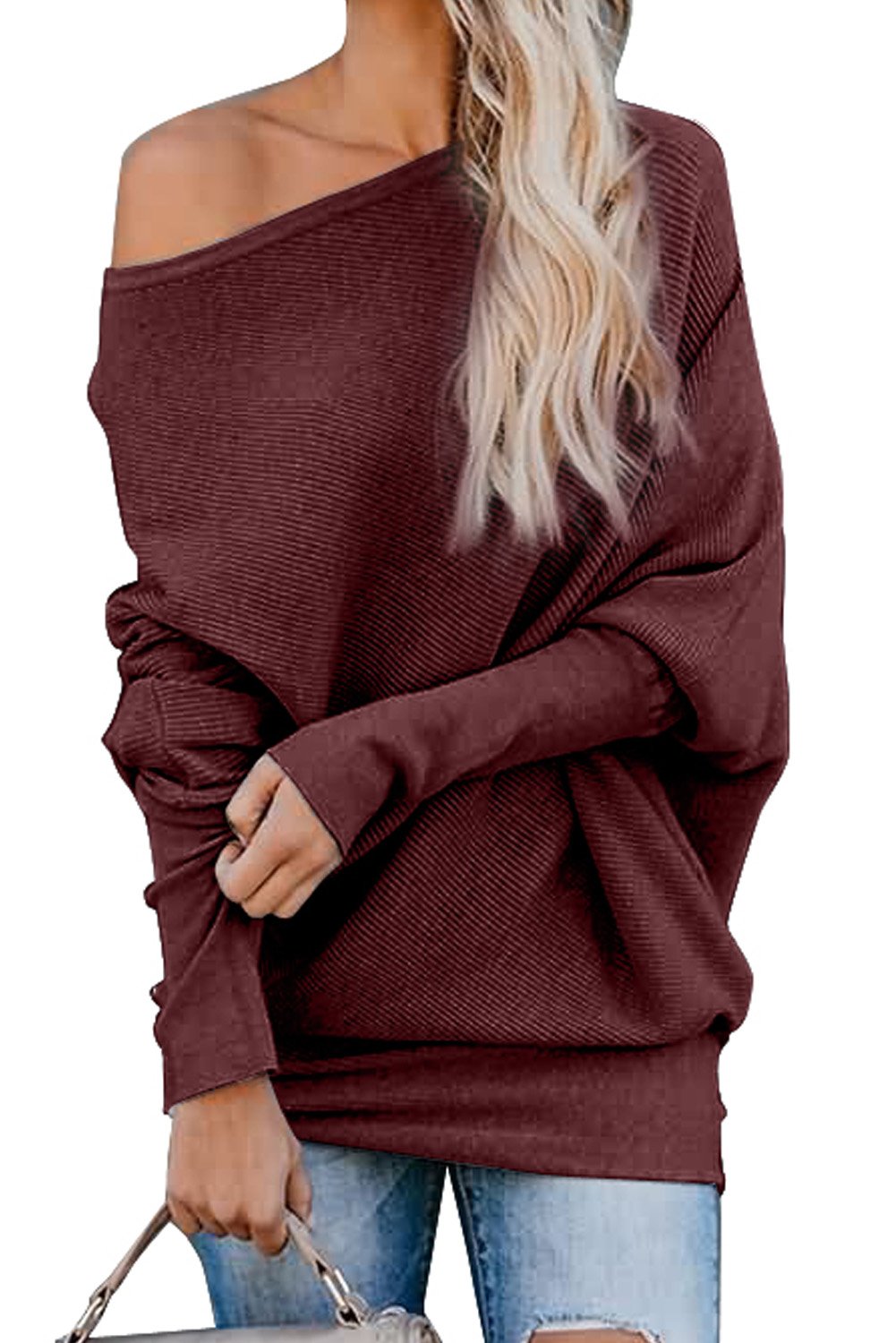 A stylish slouchy one shoulder dolman sleeves ribbed sweater in a solid color, showcasing its relaxed fit and elegant design.