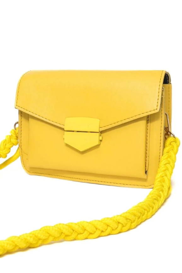 Elegant small yellow bag with braided strap made of high-quality synthetic leather.