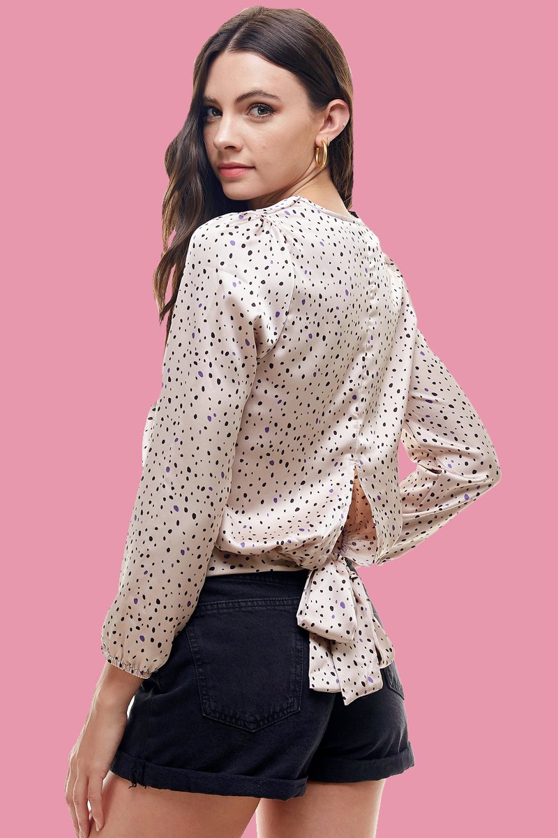 A stylish Small Dot Printed Surplice Wrap Blouse Top featuring a playful dot pattern, perfect for various occasions.