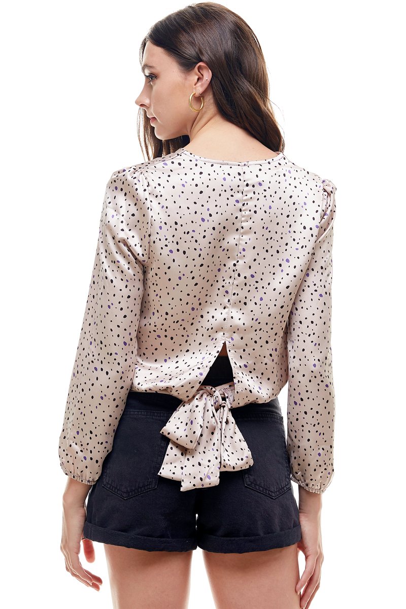 A stylish Small Dot Printed Surplice Wrap Blouse Top featuring a playful dot pattern, perfect for various occasions.