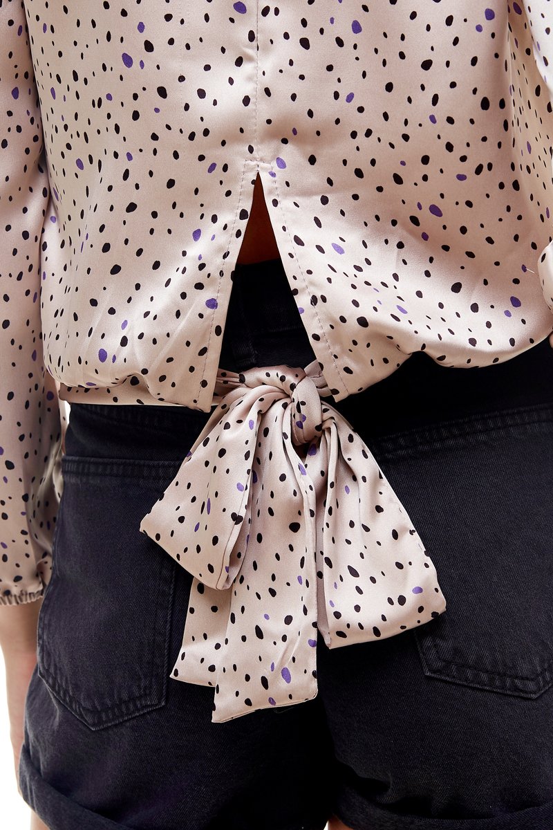 A stylish Small Dot Printed Surplice Wrap Blouse Top featuring a playful dot pattern, perfect for various occasions.