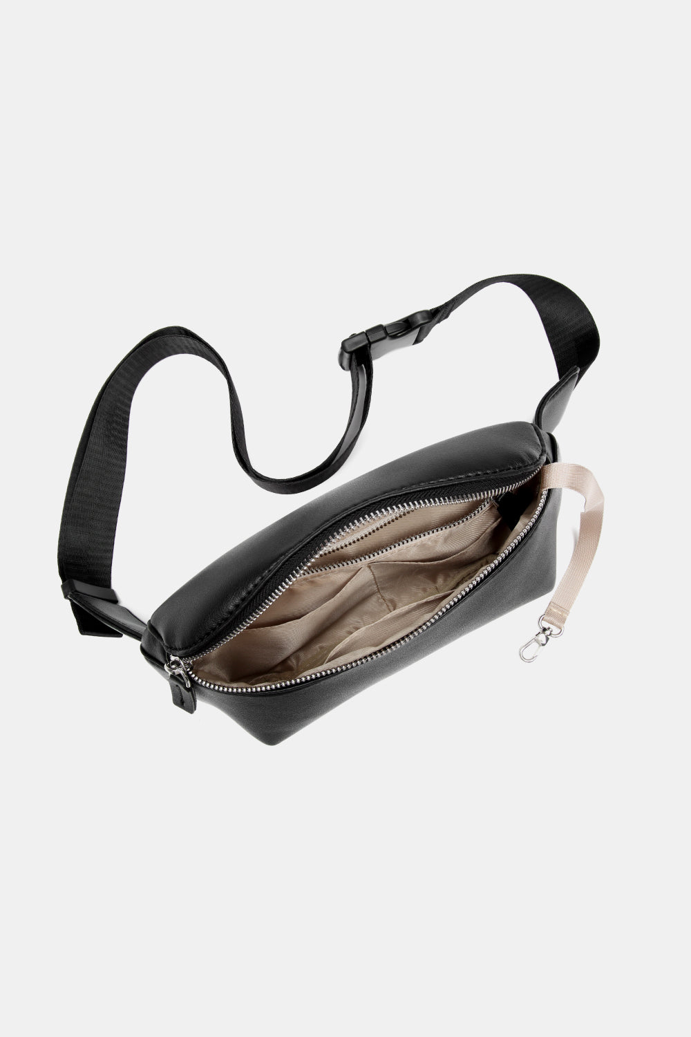 Small PU leather sling bag in solid color, showcasing its compact design and adjustable strap.