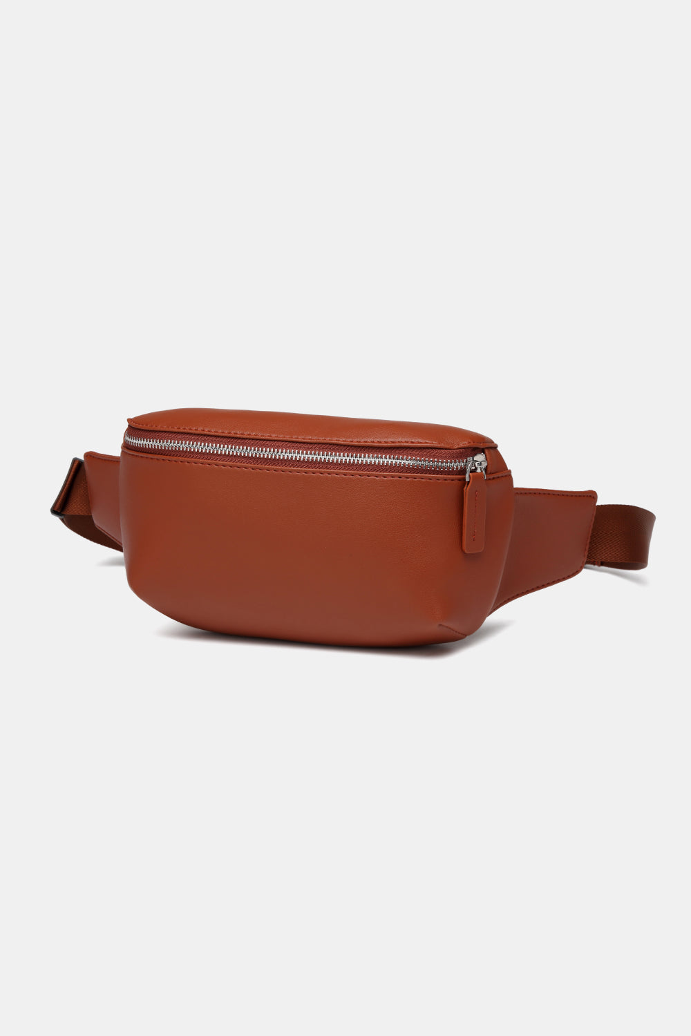 Small PU leather sling bag in solid color, showcasing its compact design and adjustable strap.