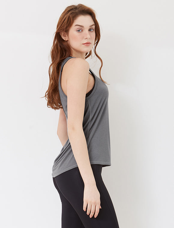 A stylish Small Talk Burnout Tank featuring an open back cut-out design, made from lightweight and breathable fabric, perfect for workouts.