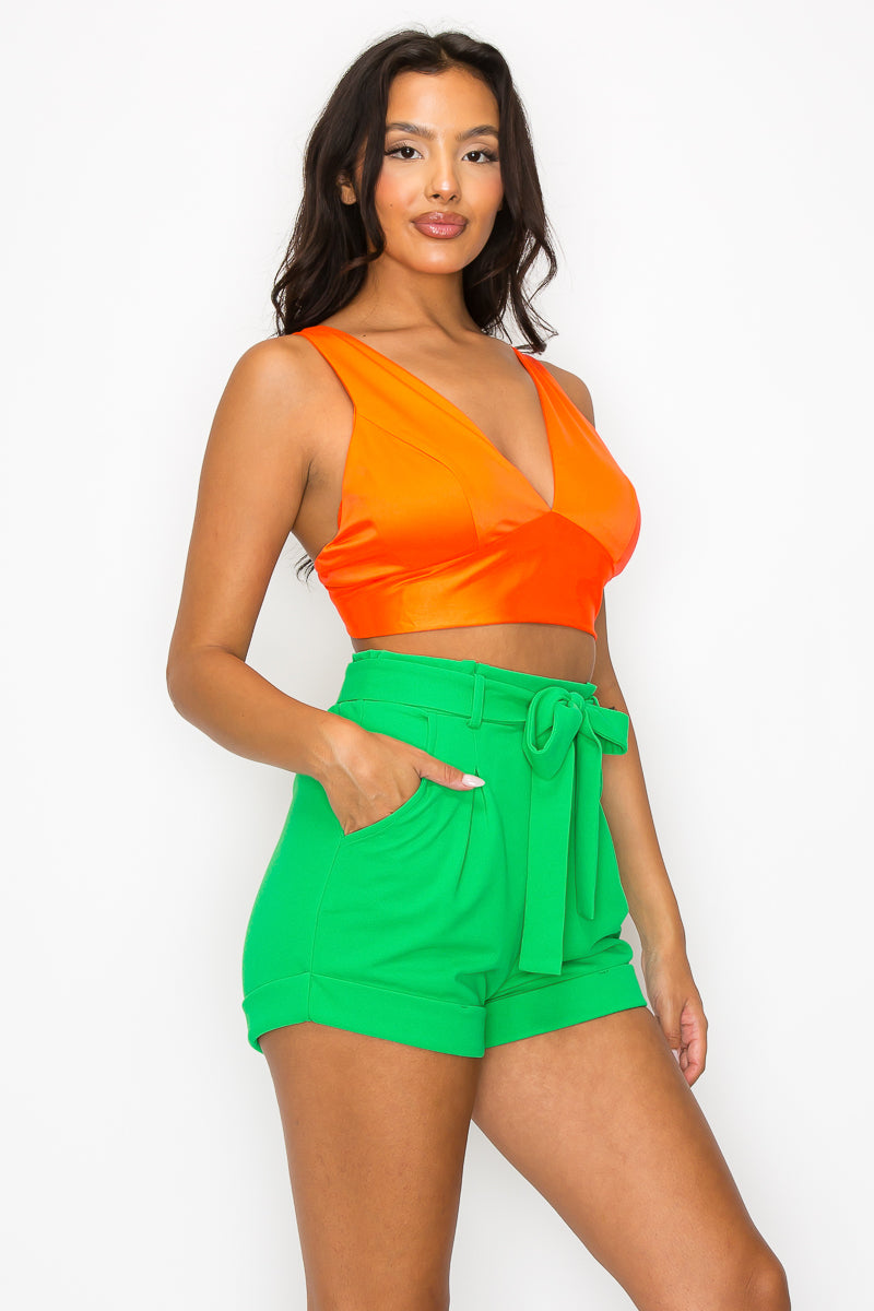 A stylish Smock V-neck Satin Bra Top in vibrant orange, featuring a deep V-neckline, sleeveless design, and adjustable straps.