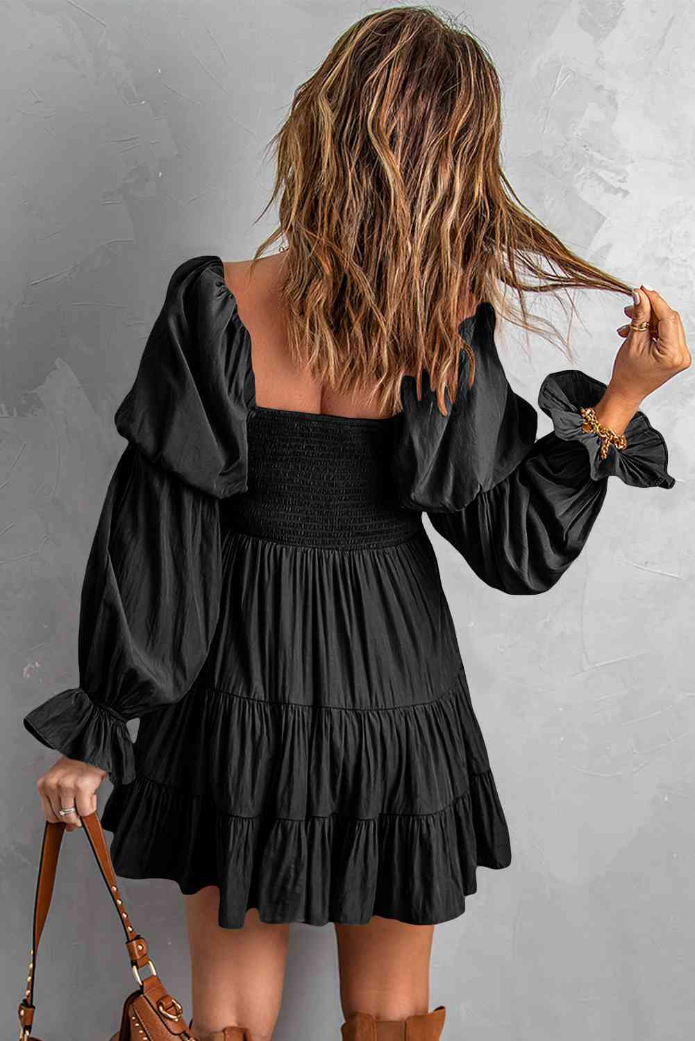 A stylish Smocked Off-Shoulder Tiered Mini Dress featuring flounce sleeves and a chic design, perfect for casual outings.