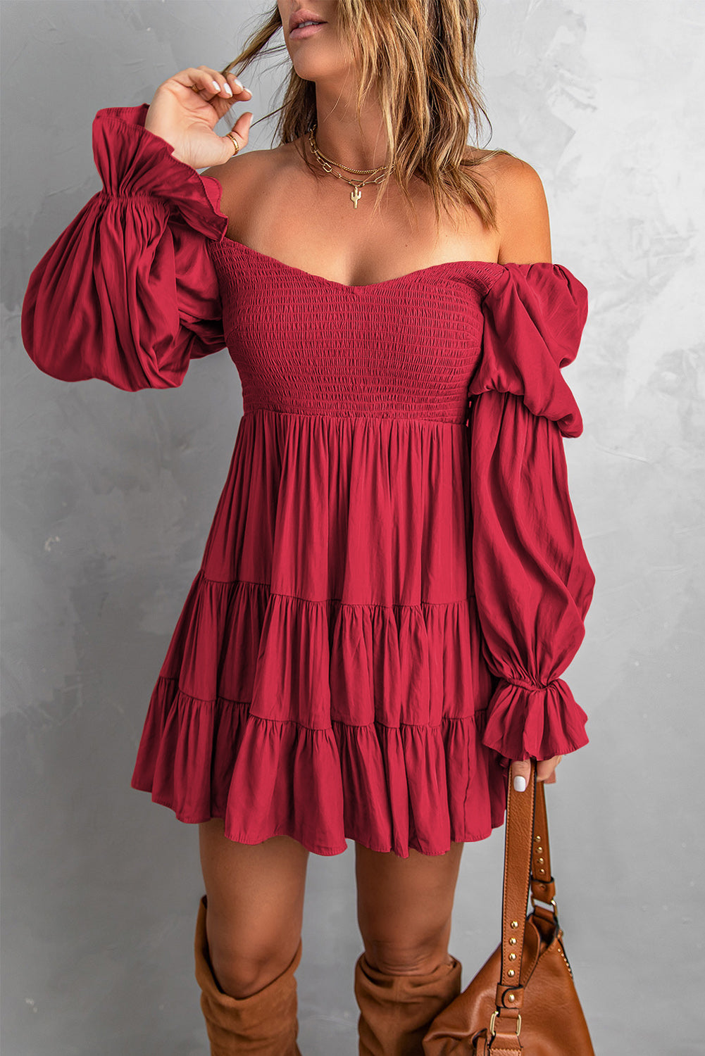 A stylish Smocked Off-Shoulder Tiered Mini Dress featuring flounce sleeves and a chic design, perfect for casual outings.