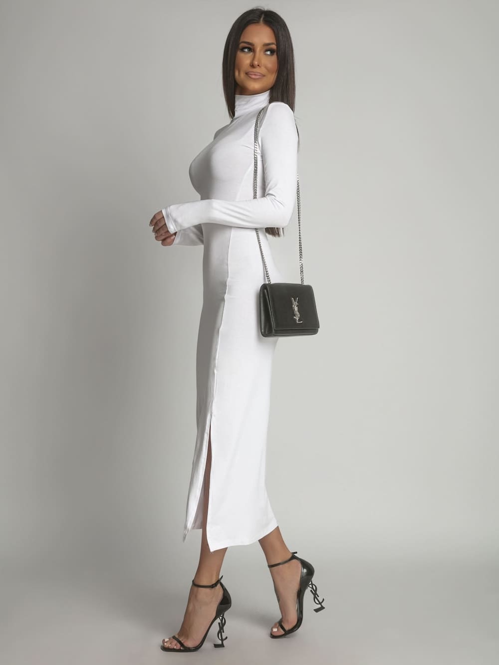 A stylish women's white turtleneck dress with long sleeves, perfect for various occasions.