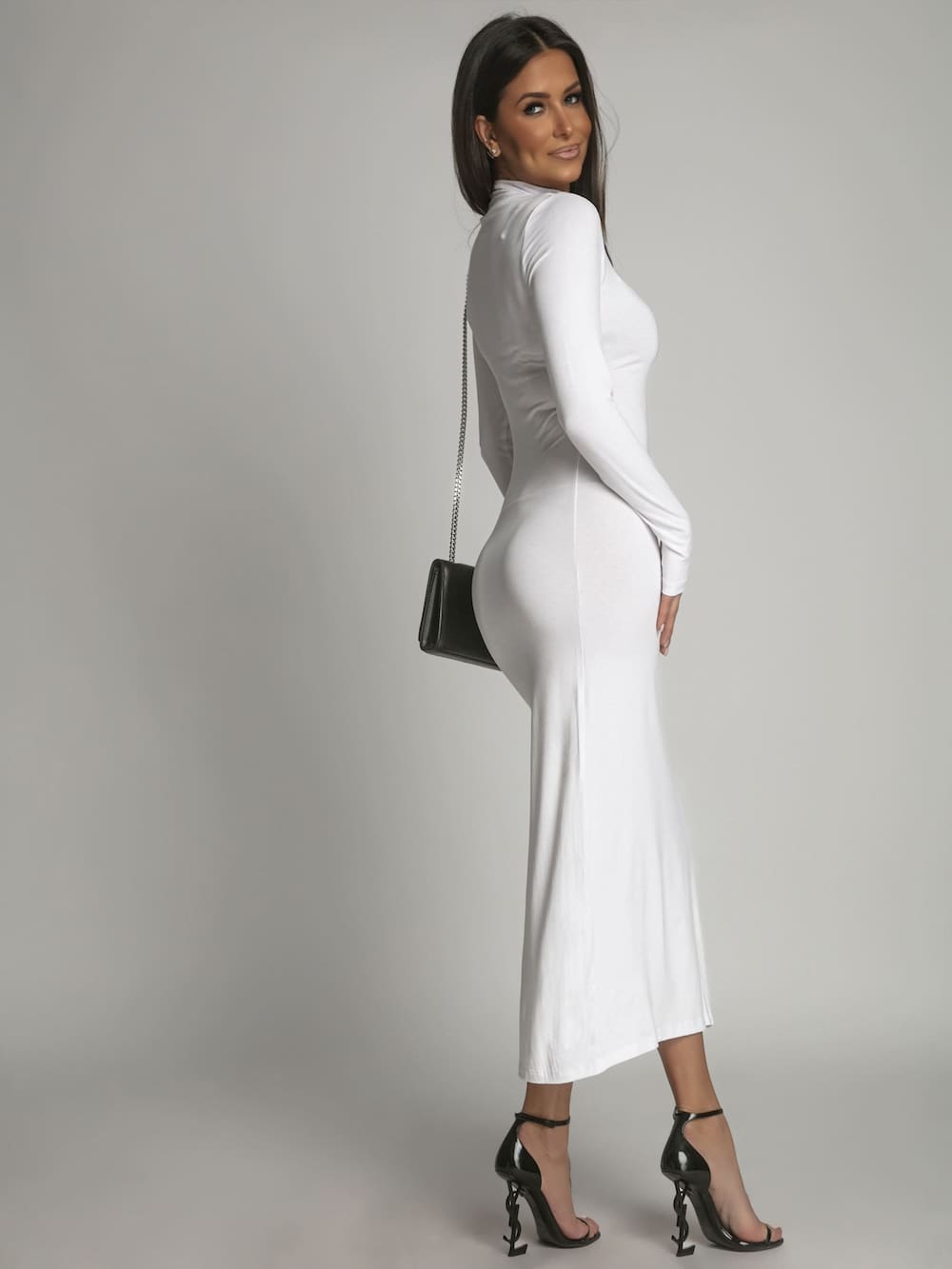 A stylish women's white turtleneck dress with long sleeves, perfect for various occasions.