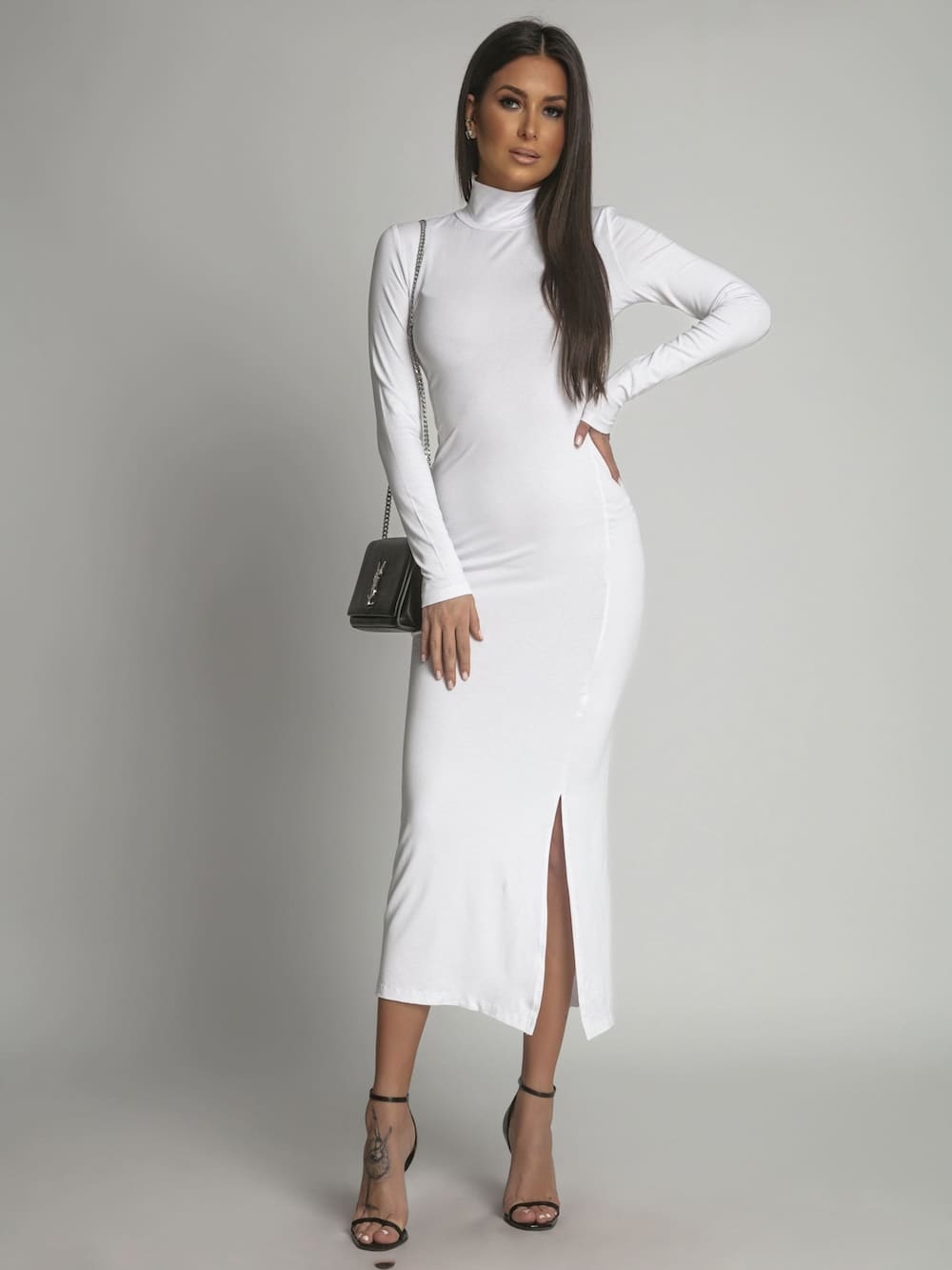 A stylish women's white turtleneck dress with long sleeves, perfect for various occasions.