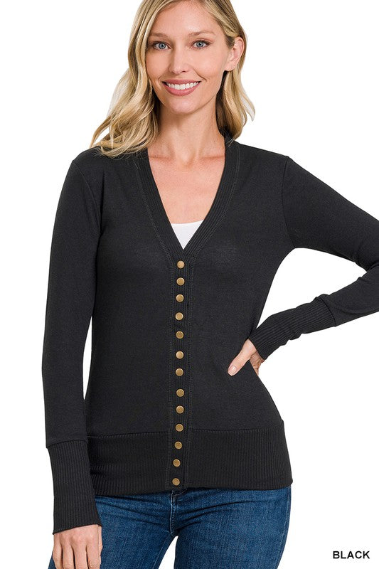 A stylish snap button sweater cardigan featuring ribbed details at the neckline, bottom, and sleeves, perfect for layering.