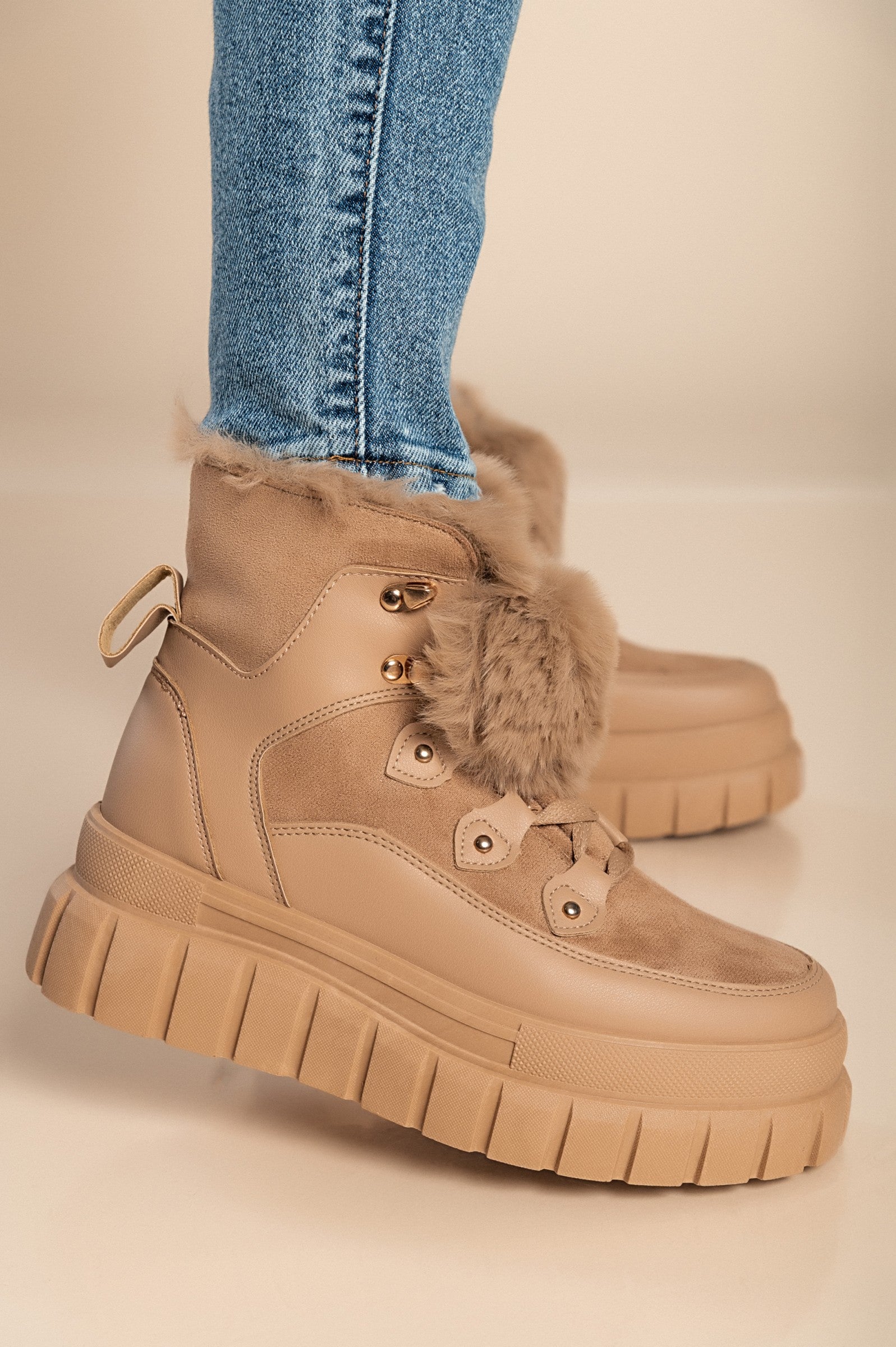 Khaki sneakers with synthetic fur lining around the ankle, featuring a raised sole and round toe design.