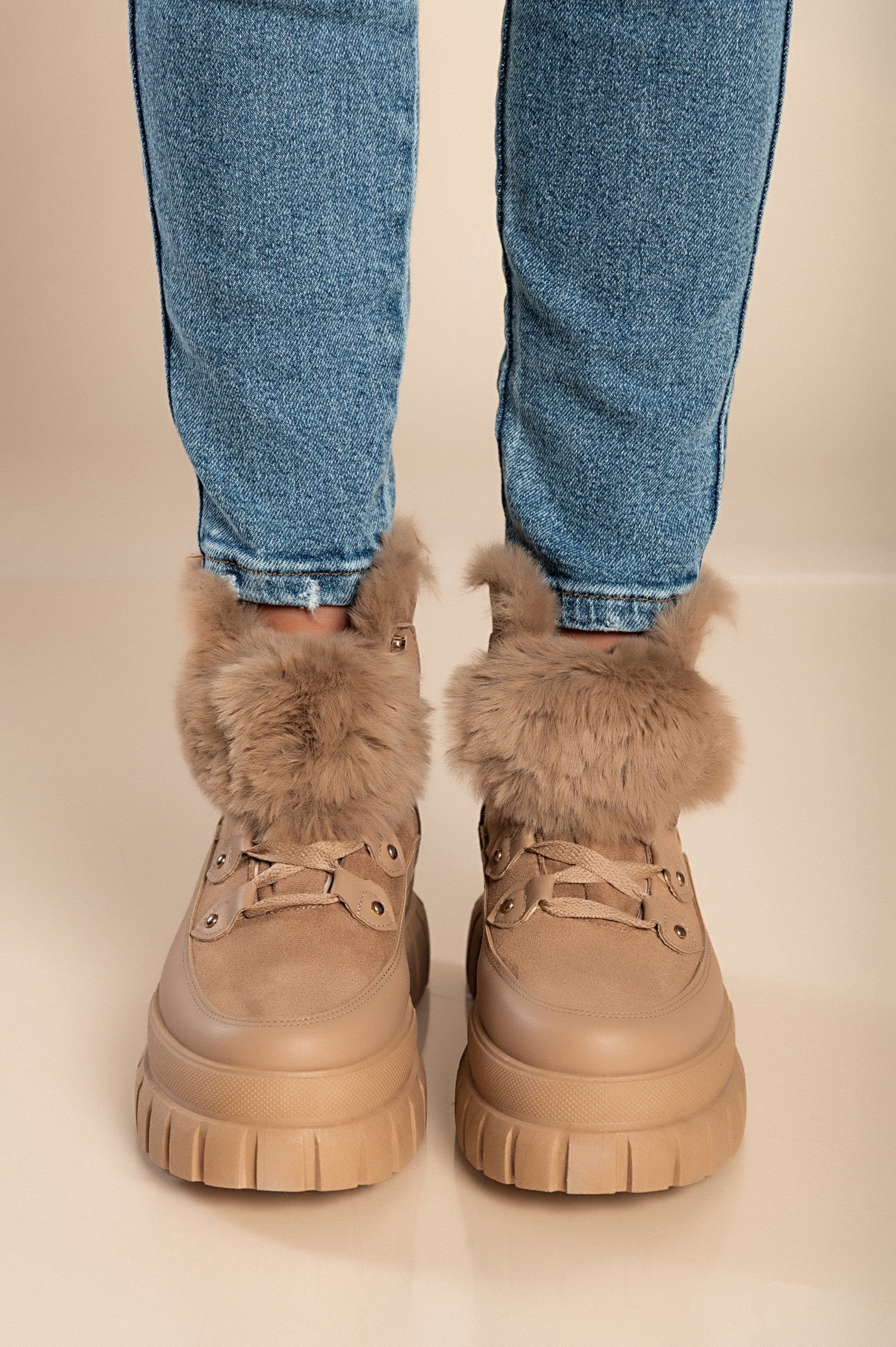 Khaki sneakers with synthetic fur around the ankle, featuring a raised sole and round toe design, perfect for casual wear.