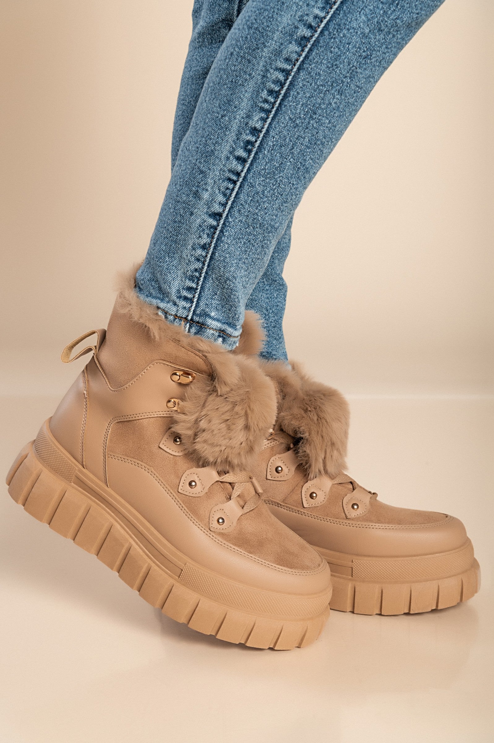 Khaki sneakers with synthetic fur around the ankle, featuring a raised sole and round toe design, perfect for casual wear.