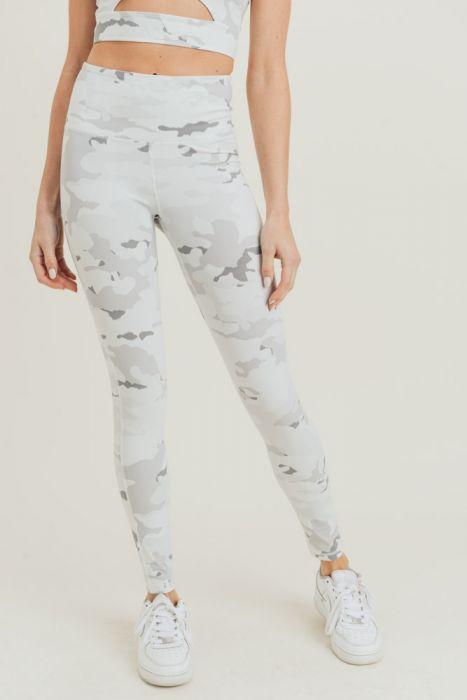 A pair of full-length Snow Camo Highwaist Leggings featuring a high waistband and discreet pouch, designed for comfort and style.