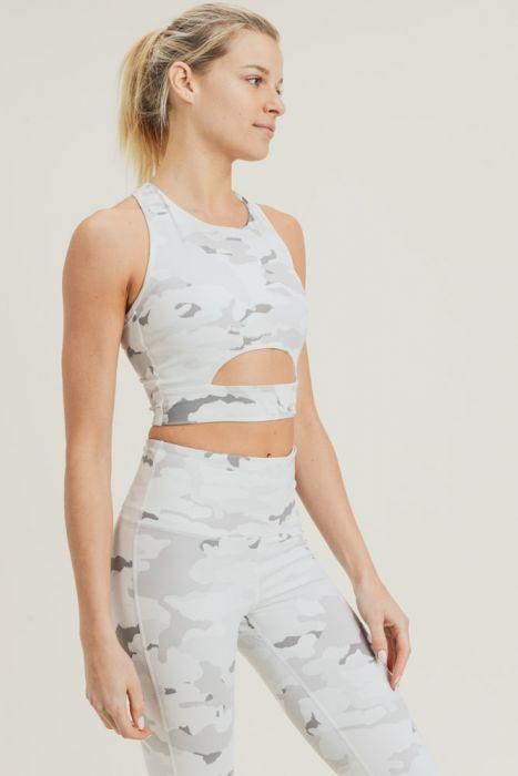 Snow camo sport crop top with peekaboo front, made of nylon and spandex, ideal for activewear.