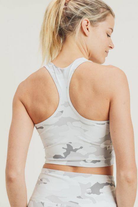 Snow camo sport crop top with peekaboo front, made of nylon and spandex, ideal for activewear.