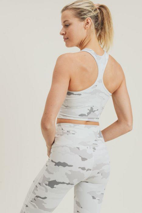 Snow camo sport crop top with peekaboo front, made of nylon and spandex, ideal for activewear.