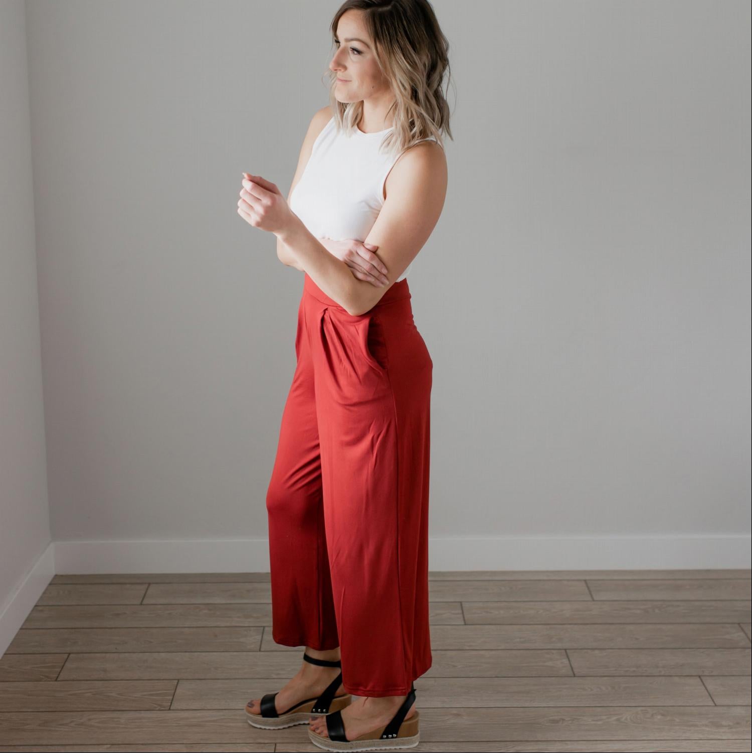 Soft brushed wide legged palazzo pants in a light fabric, featuring front pockets and a trendy silhouette, perfect for casual or dressy occasions.