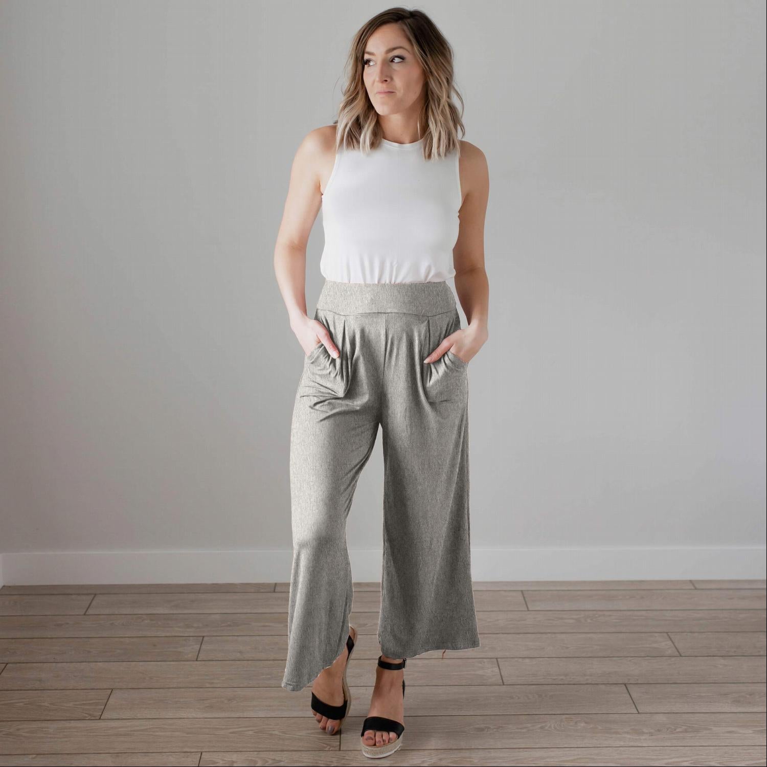 Soft brushed wide legged palazzo pants in a light fabric, featuring front pockets and a trendy silhouette, perfect for casual or dressy occasions.