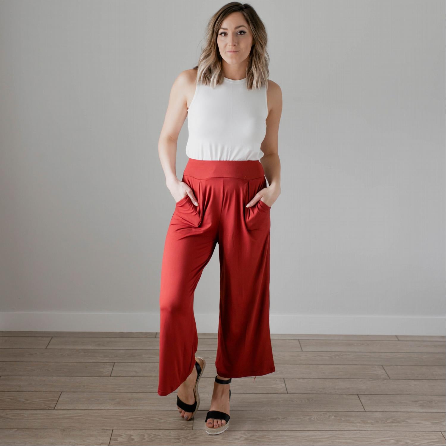 Soft brushed wide legged palazzo pants in a light fabric, featuring front pockets and a trendy silhouette, perfect for casual or dressy occasions.