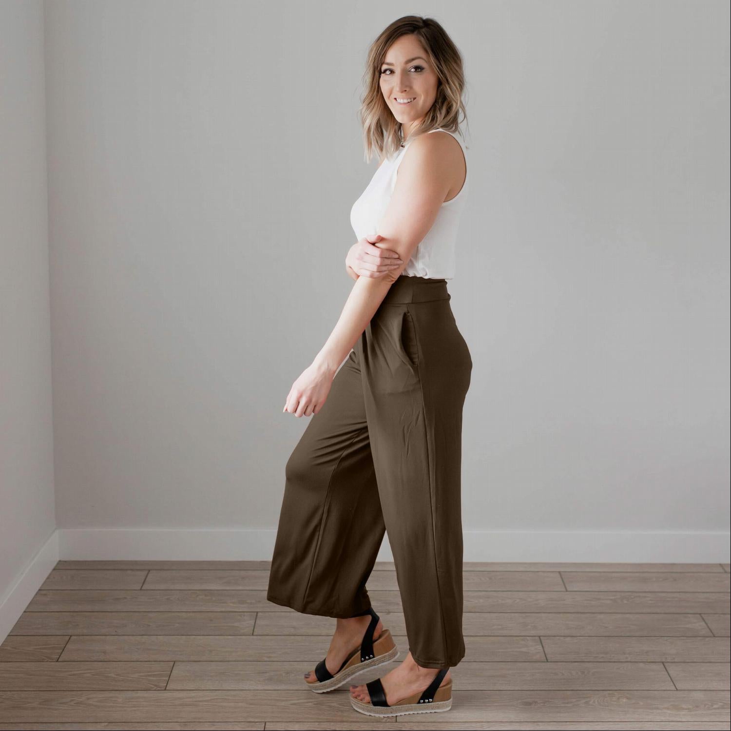 Soft brushed wide legged palazzo pants in a light fabric, featuring front pockets and a trendy silhouette, perfect for casual or dressy occasions.