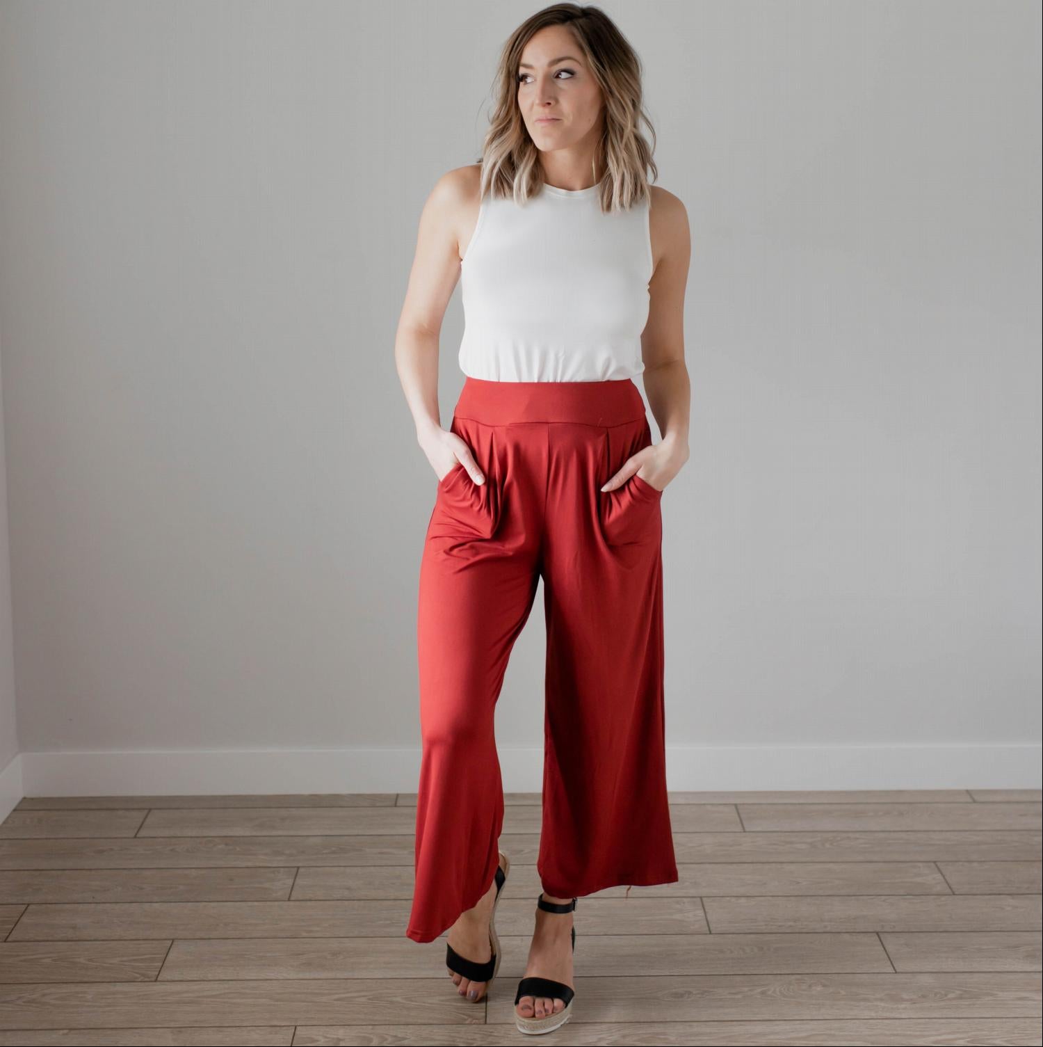 Soft brushed wide legged palazzo pants in a light fabric, featuring front pockets and a trendy silhouette, perfect for casual or dressy occasions.