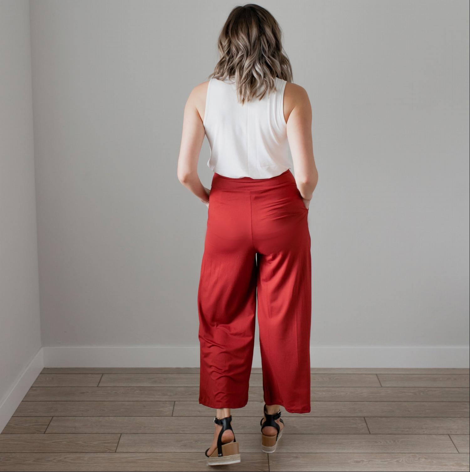 Soft brushed wide legged palazzo pants in a light fabric, featuring front pockets and a trendy silhouette, perfect for casual or dressy occasions.