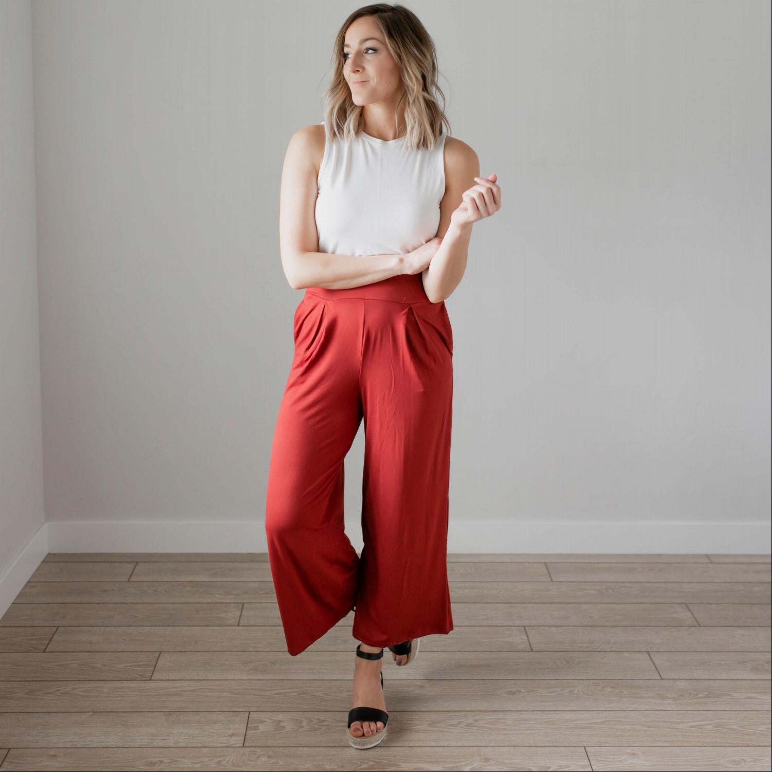 Soft brushed wide legged palazzo pants in a light fabric, featuring front pockets and a trendy silhouette, perfect for casual or dressy occasions.