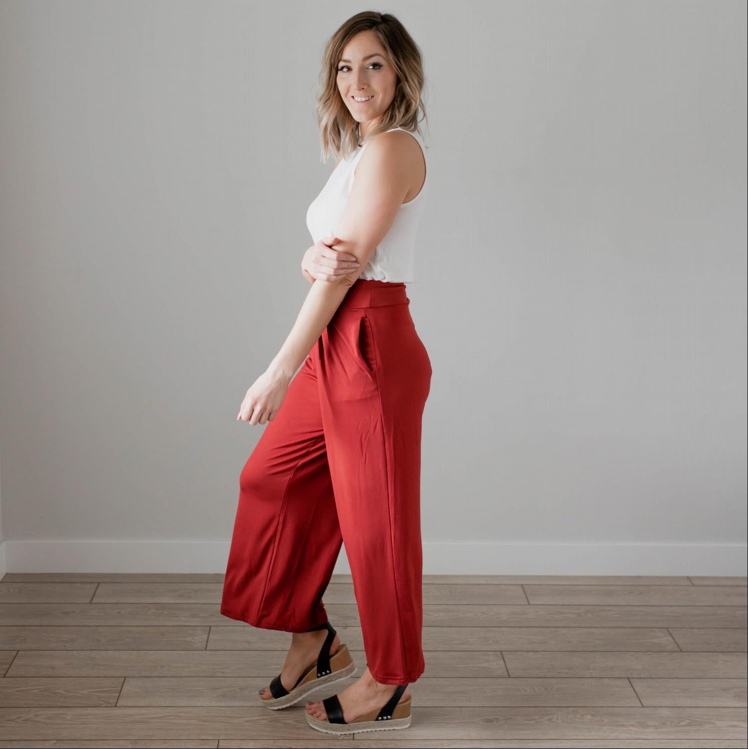 Soft brushed wide legged palazzo pants in a light fabric, featuring front pockets and a trendy silhouette, perfect for casual or dressy occasions.