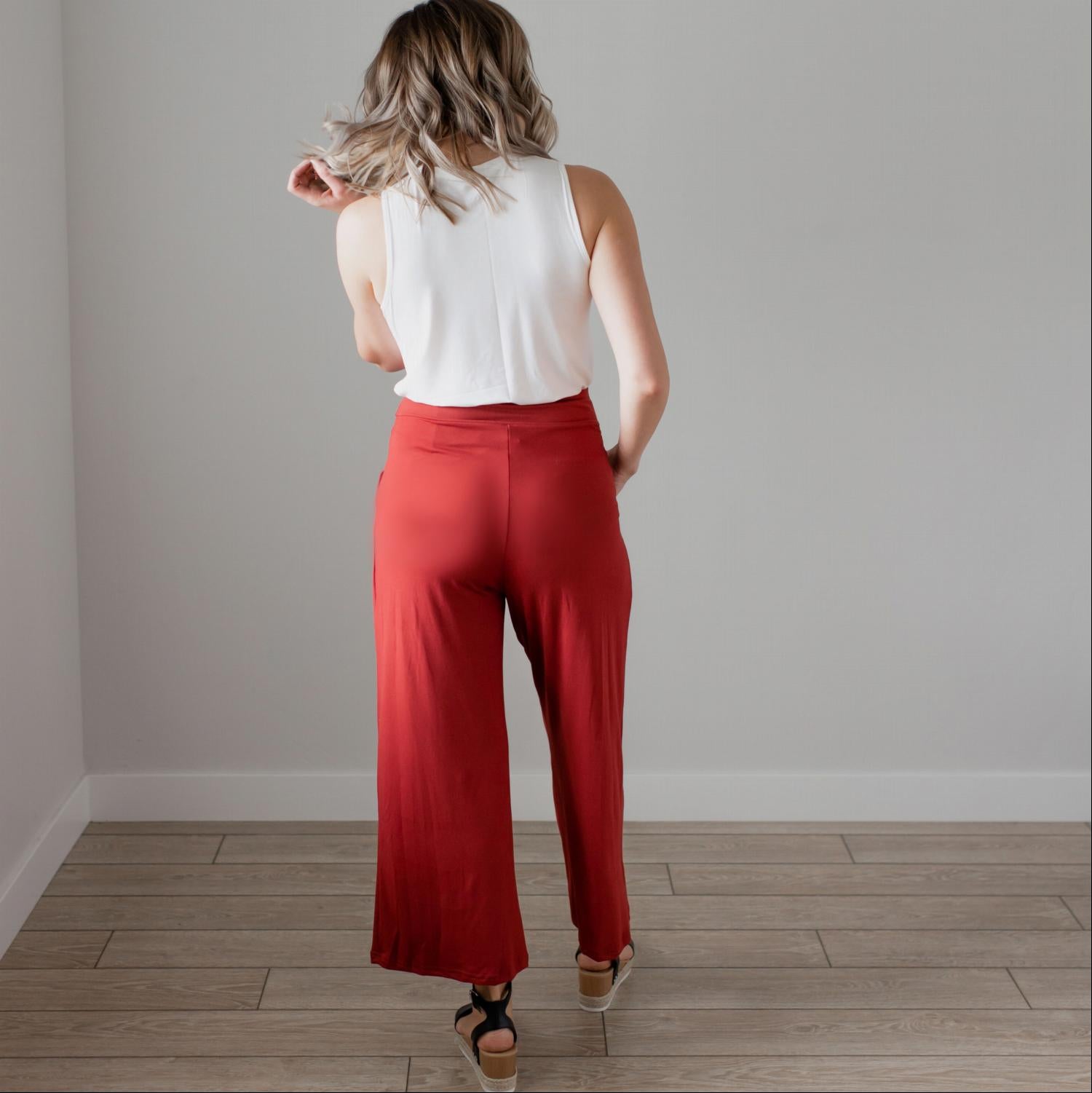 Soft brushed wide legged palazzo pants in a light fabric, featuring front pockets and a trendy silhouette, perfect for casual or dressy occasions.