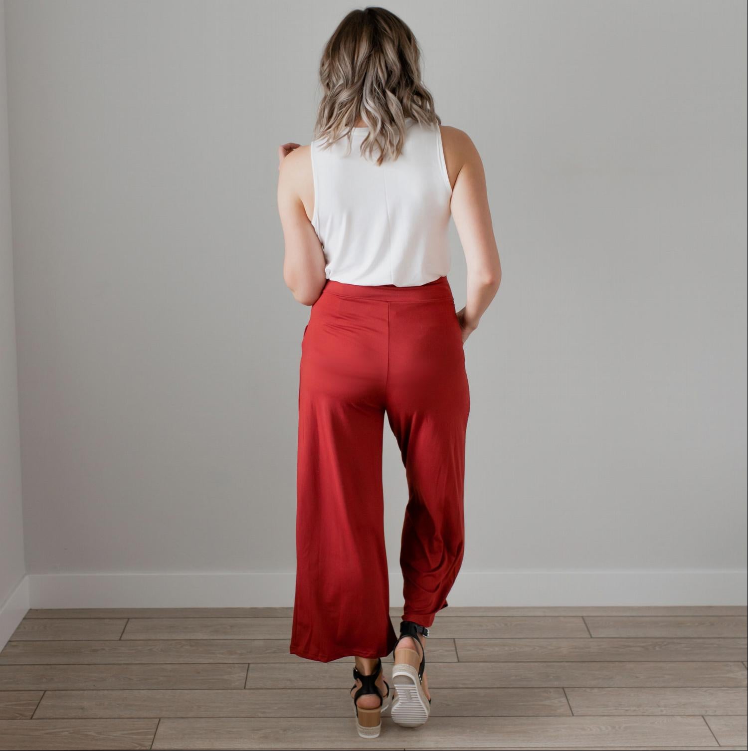 Soft brushed wide legged palazzo pants in a light fabric, featuring front pockets and a trendy silhouette, perfect for casual or dressy occasions.