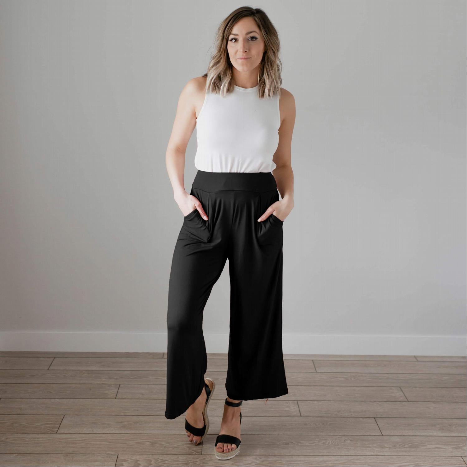 Soft brushed wide legged palazzo pants in a light fabric, featuring front pockets and a trendy silhouette, perfect for casual or dressy occasions.