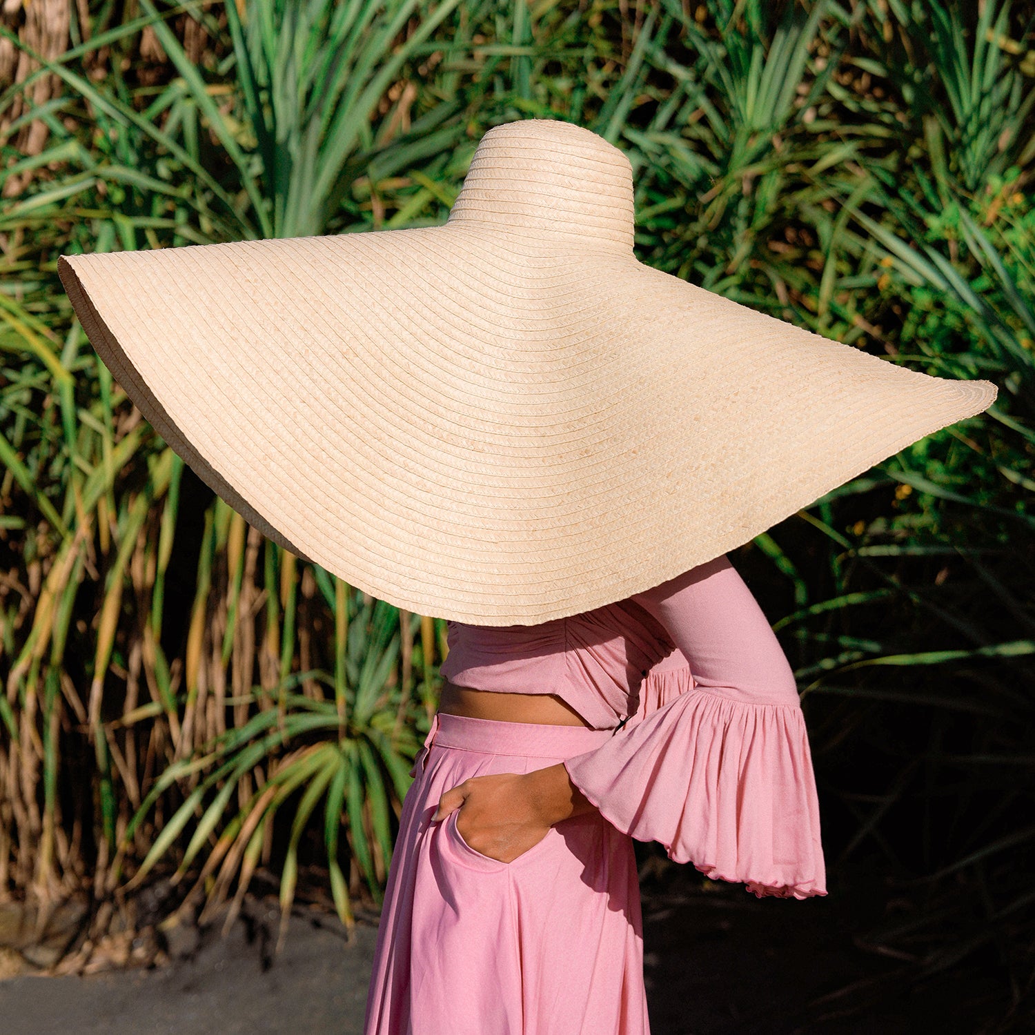 SOLANA Oversized Straw Hat in Natural Beige with a wide brim, showcasing its handmade craftsmanship and natural straw material.