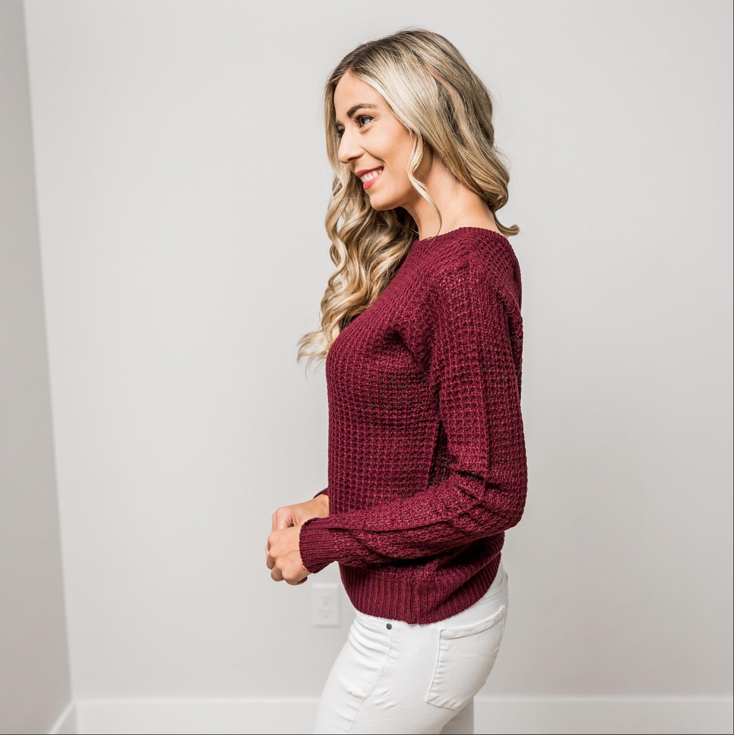 A stylish Solid Lace Up Back Knit Sweater Top featuring a criss-cross back design and elegant cut-out details, perfect for a chic look.