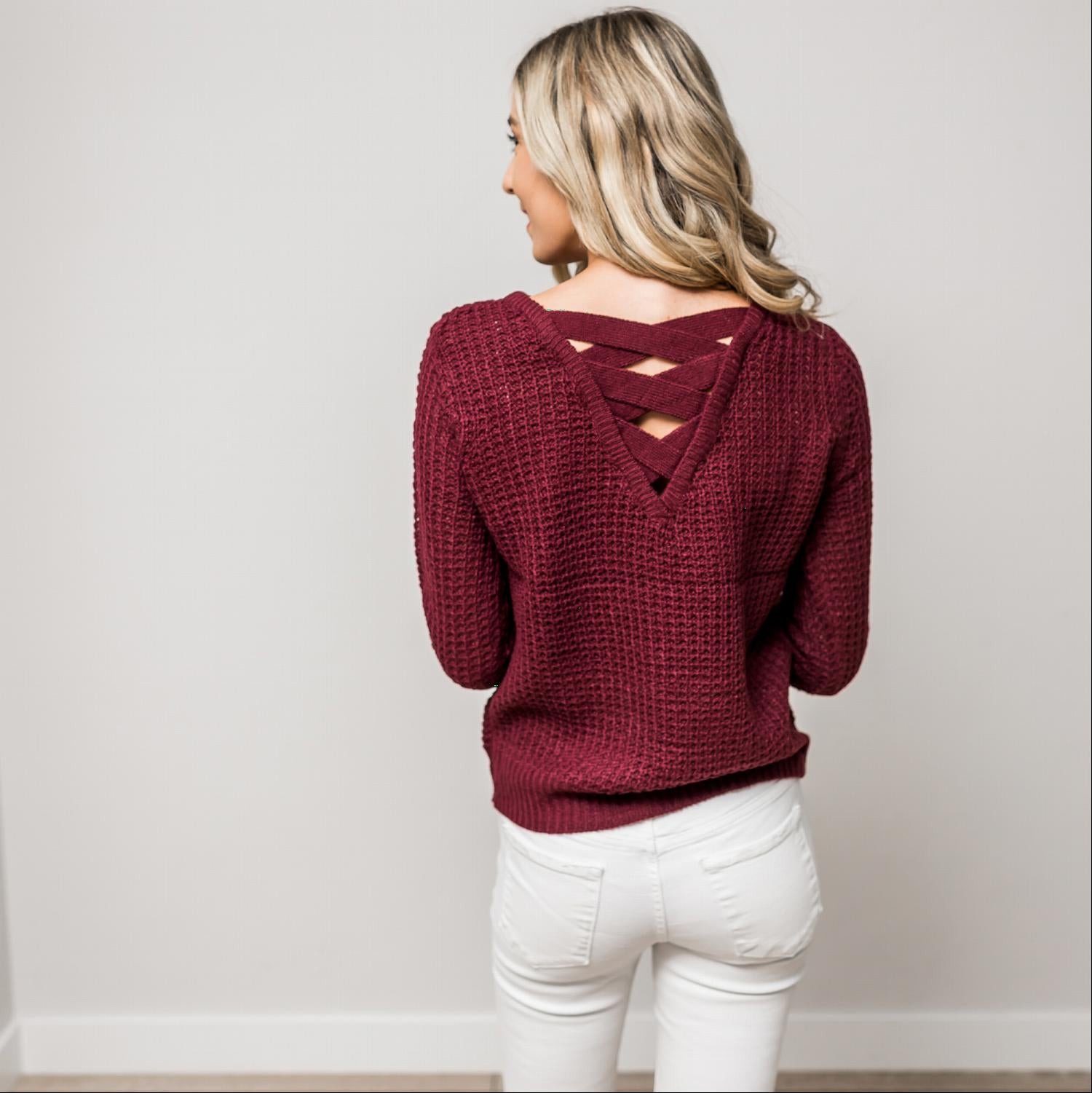 A stylish Solid Lace Up Back Knit Sweater Top featuring a criss-cross back design and elegant cut-out details, perfect for a chic look.